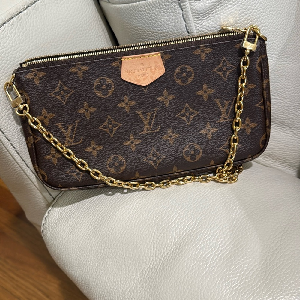Authentic LV Large Pouch from the multi pochette accessories. With an LV chain.